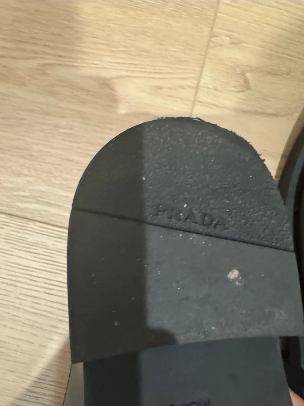 Prada women’s Black Leather Slide Loafers with Triangle Logo